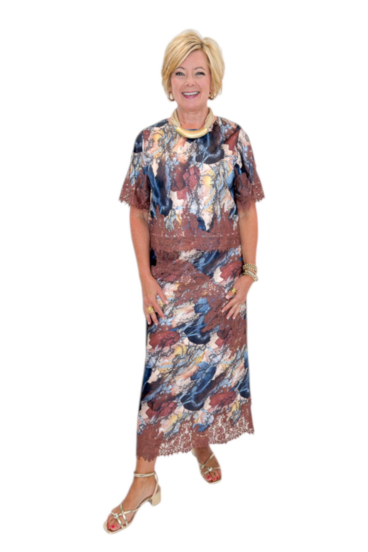 Front view of woman wearing Swagger Boutique’s Multi Snake Print Lace Trim Top with Multi Snake Print Lace Trim Midi Skirt against white studio background.