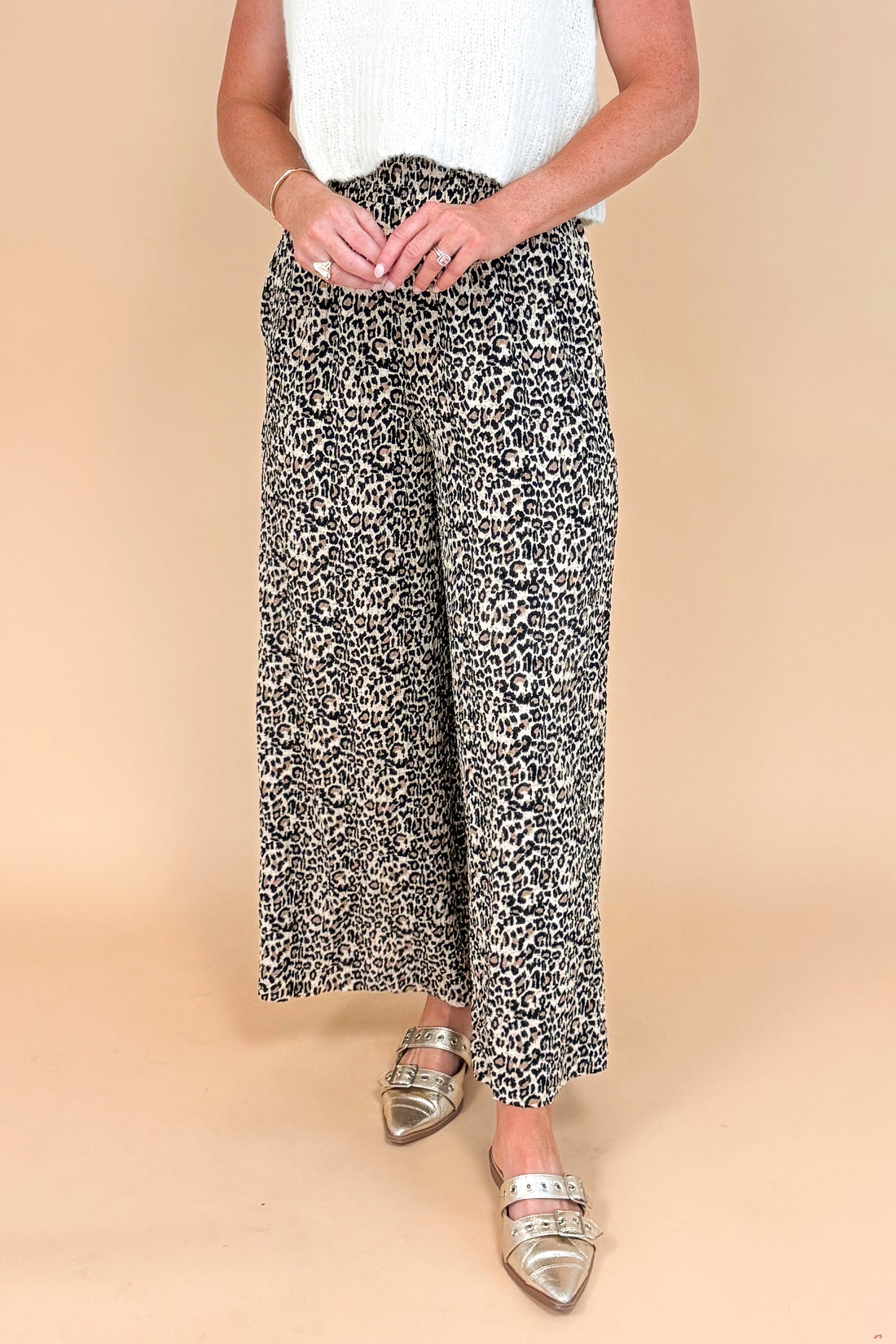 Leopard print textured pants - side view highlighting the wide leg silhouette and pleated details