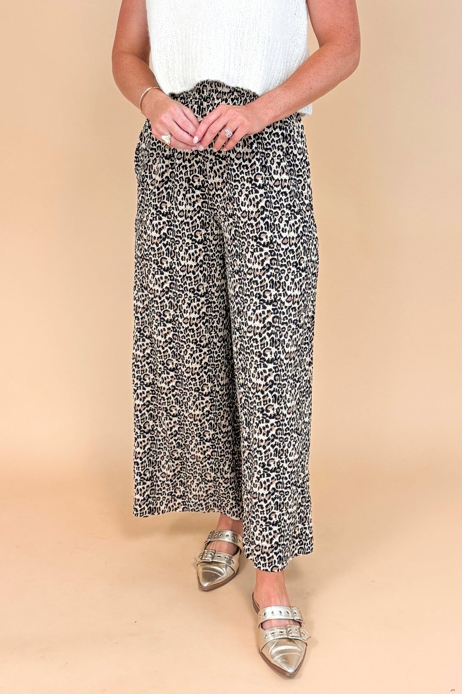 Leopard print textured pants - side view highlighting the wide leg silhouette and pleated details