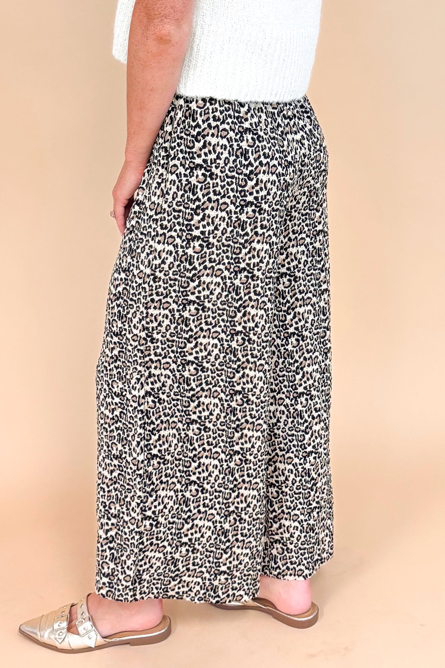 Leopard print textured pants - side view highlighting the wide leg silhouette and pleated details