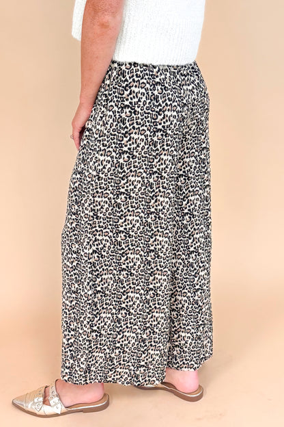 Leopard print textured pants - side view highlighting the wide leg silhouette and pleated details