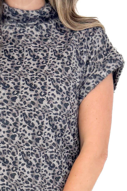 Front detailed view of woman wearing Grey Leopard Short Sleeve Fuzzy Top.