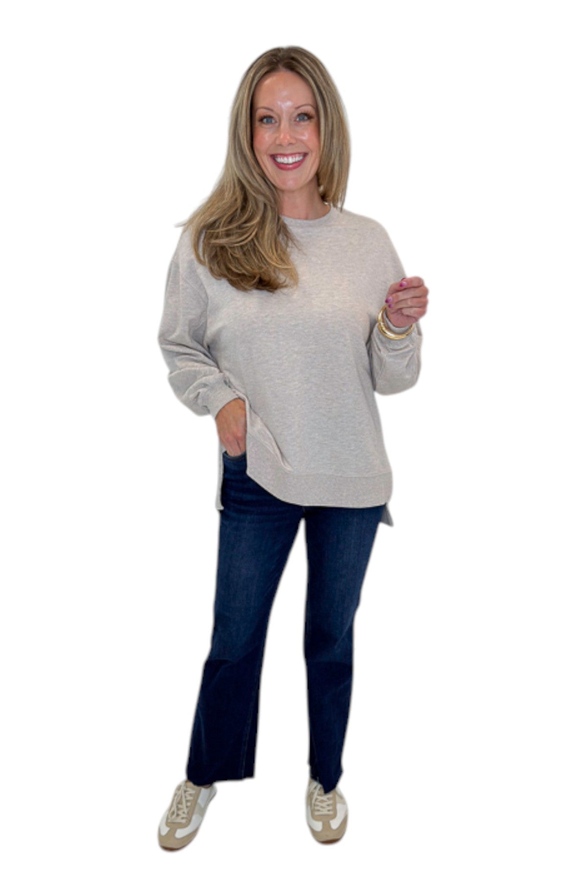 Front view of woman wearing Swagger Boutique’s Natural Heather Modern Weekender by Z Supply with jeans against white studio background.