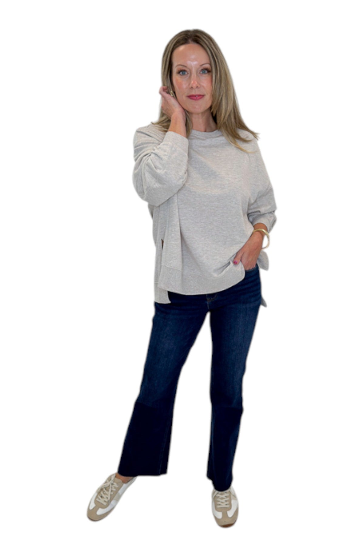 Front view of woman wearing Swagger Boutique’s Natural Heather Modern Weekender by Z Supply with jeans against white studio background.