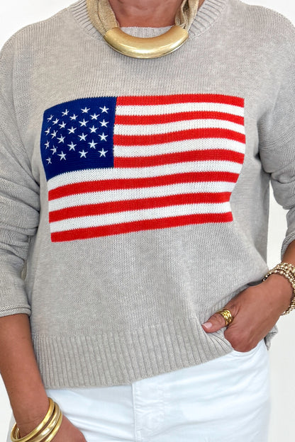 Front detail view of woman wearing Swagger Boutique’s Sienna Patriot Sweater In Natural Heather by Z Supply with jeans against white studio background. 