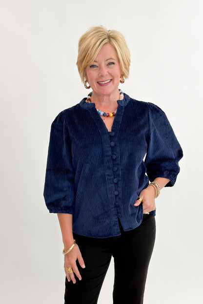 Front view of woman wearing Swagger Boutique’s Navy Corduroy Half Sleeve Top with jeans against white studio background.