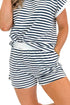 Front detail view of woman wearing Swagger Boutique’s Navy Striped Relaxed Fit Top & Shorts against white studio background. 