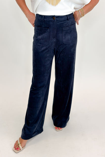 Front view of woman wearing Swagger Boutique’s Navy Suede Wide Leg Pants with sweater against white studio background.