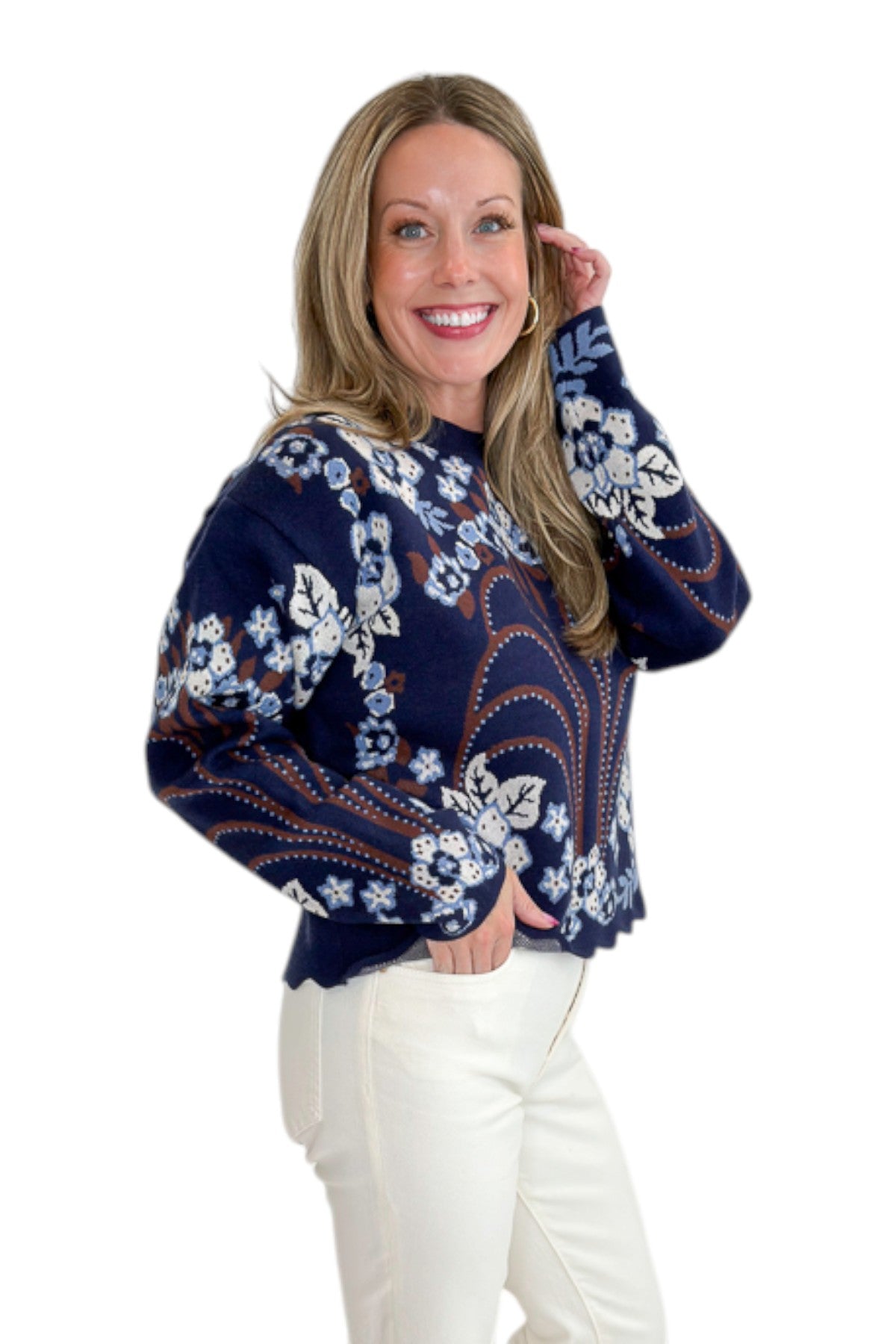 Side view of woman wearing Swagger Boutique’s Navy &amp; Brown Printed Sweater by THML with jeans against white studio background.