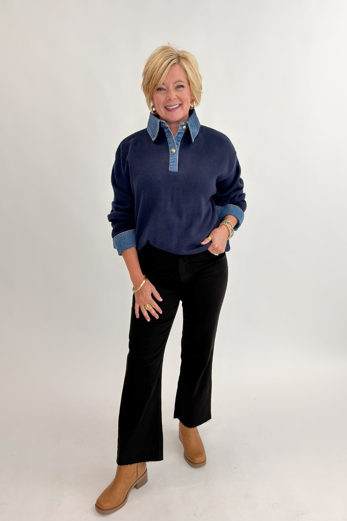 Front view of woman wearing Swagger Boutique’s Navy &amp; Denim Collared Sweater with jeans against white studio background.
