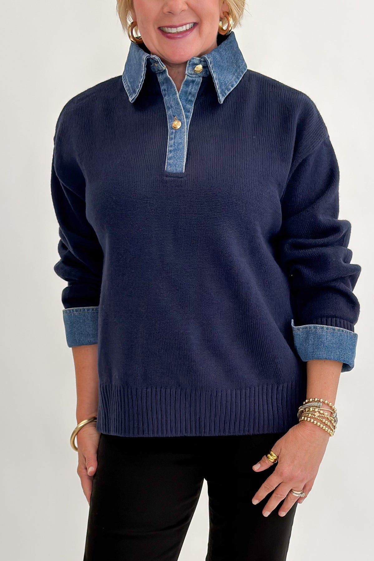 Front detail view of woman wearing Swagger Boutique’s Navy &amp; Denim Collared Sweater with jeans against white studio background.
