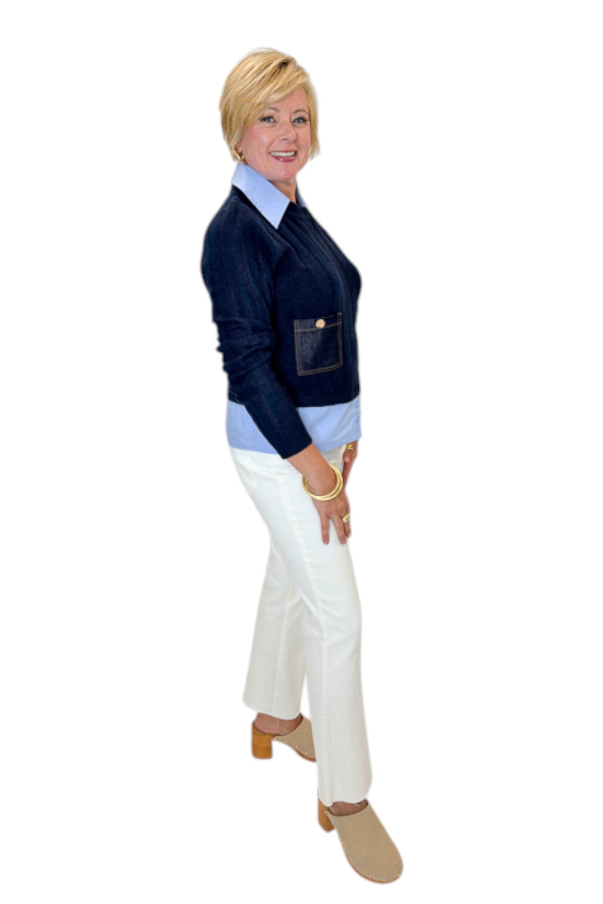Side view of woman wearing Swagger Boutique’s Navy &amp; Denim Pocket Sweater with jeans against white studio background.