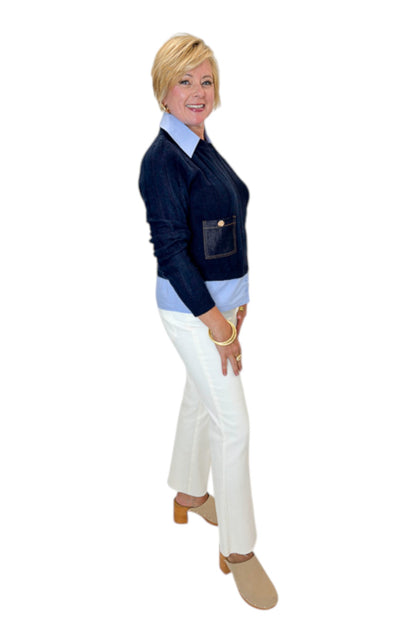 Side view of woman wearing Swagger Boutique’s Navy &amp; Denim Pocket Sweater with jeans against white studio background.
