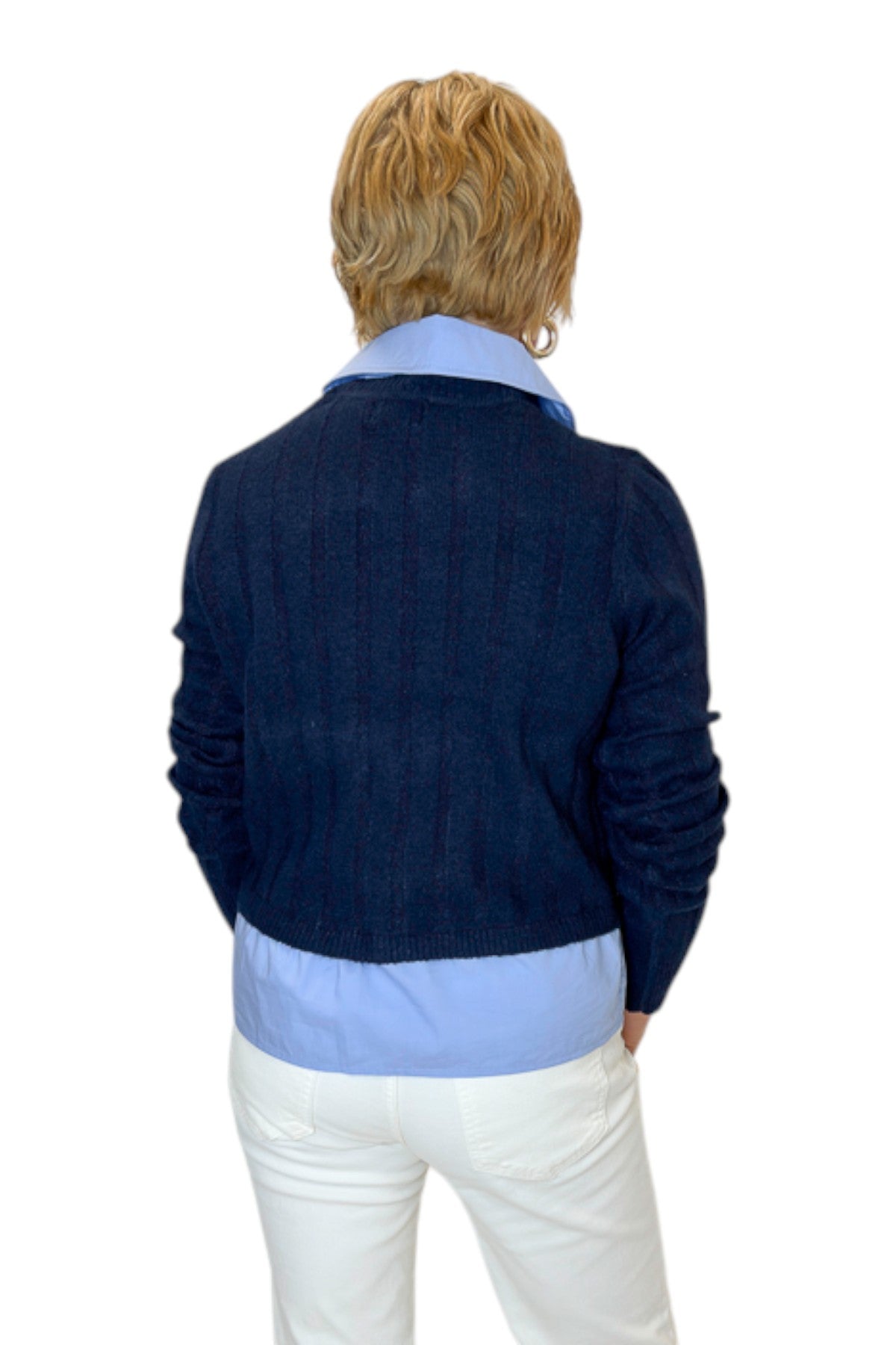 Back view of woman wearing Swagger Boutique’s Navy &amp; Denim Pocket Sweater with jeans against white studio background.