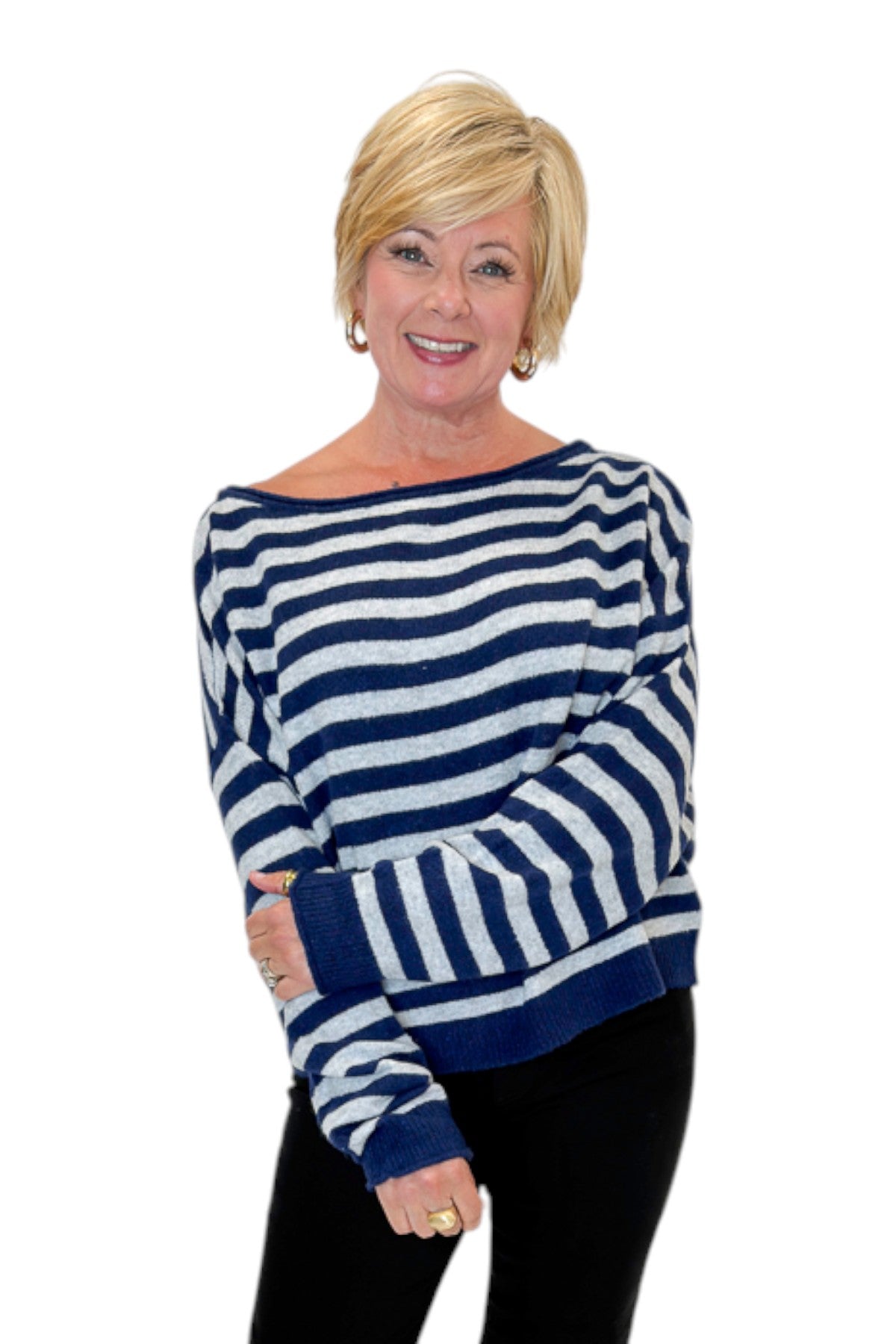 Front view of woman wearing Swagger Boutique’s Navy &amp; Grey Striped Sweater with jeans against white studio background.