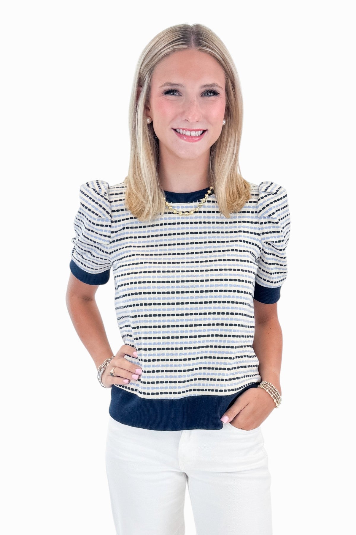 Front view of woman wearing Swagger Boutique’s Navy &amp; Light Blue Striped Short Sleeve Top by Entro with jeans against white studio background.