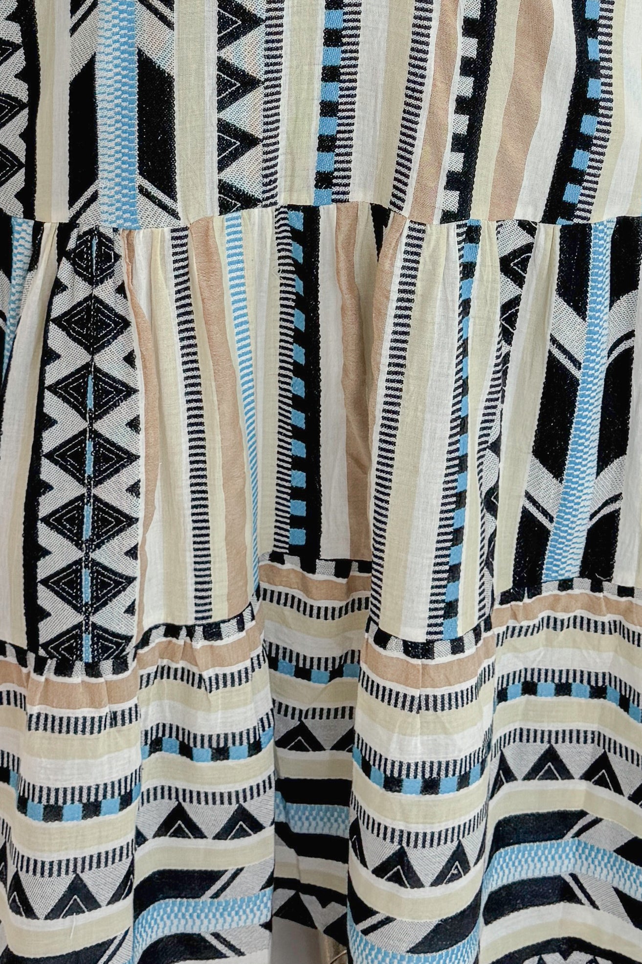 view of Swagger Boutique’s Neutral Aztec Print Maxi Dress fabric