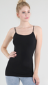 A woman modeling a black spaghetti-strap camisole tank top against a light gray studio background.