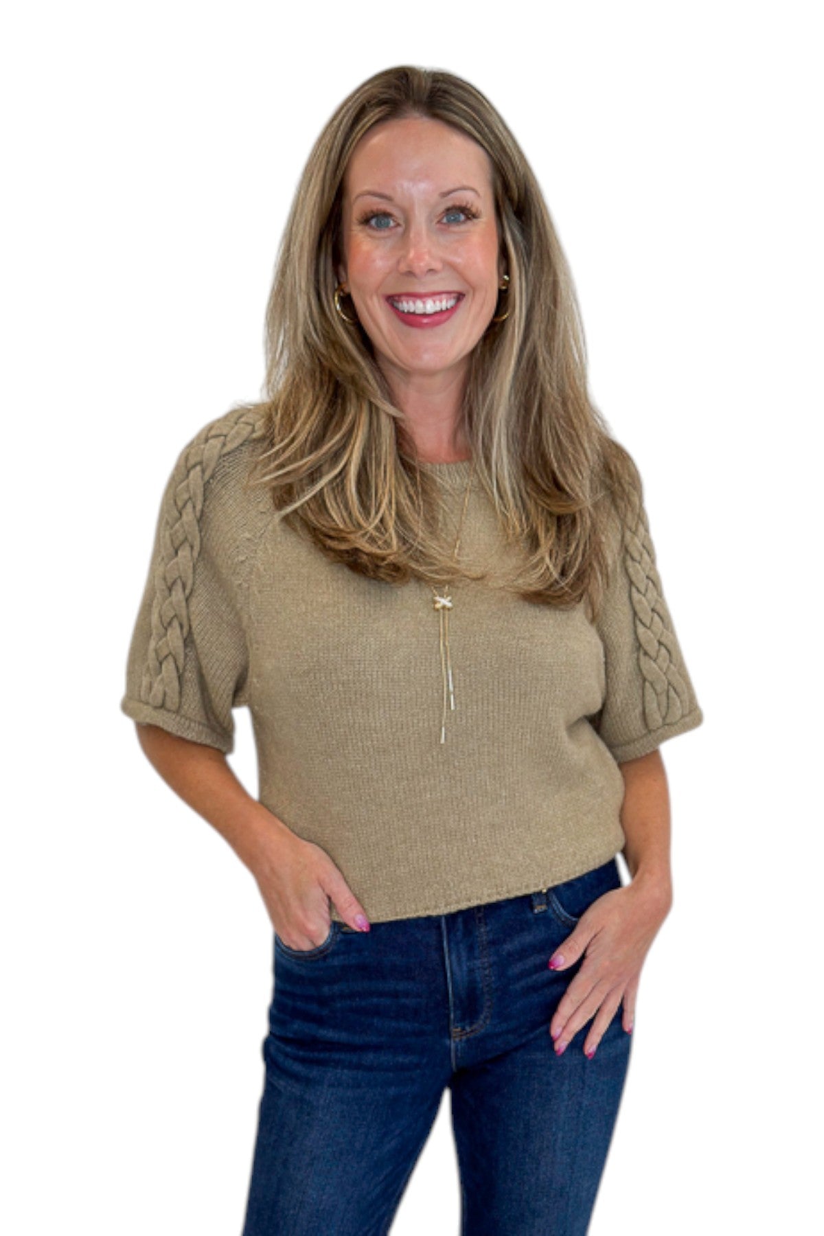 Front view of woman wearing Oatmeal Braid Detail Short Sleeve Sweater by Entro with jeans against white studio background.