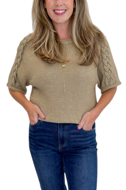 Front detail view of woman wearing Oatmeal Braid Detail Short Sleeve Sweater by Entro with jeans against white studio background.
