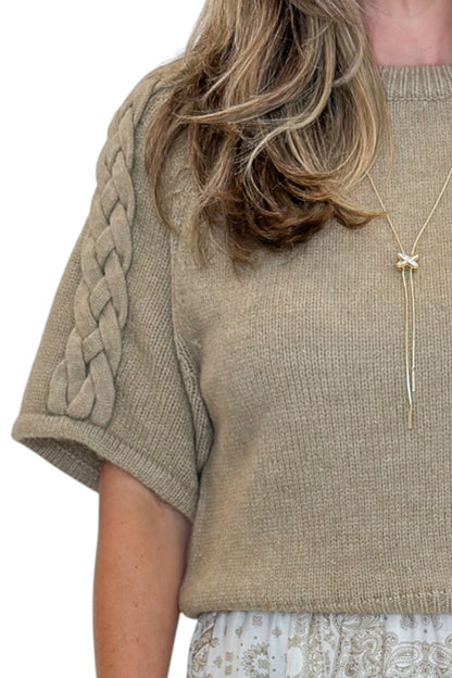 Front detail view of woman wearing Oatmeal Braid Detail Short Sleeve Sweater by Entro with jeans against white studio background.