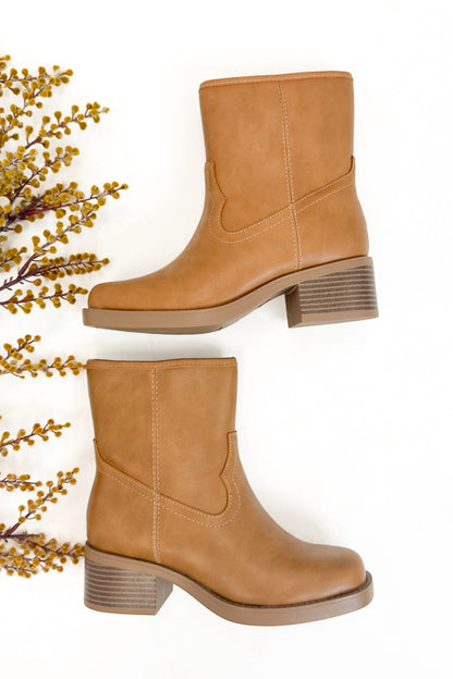 Oberon- Natural Booties side view against white studio background.