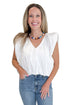 Front view of woman wearing Swagger Boutique’s Off White Bubble Hem Pleated Top with jeans against white studio background.