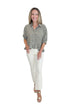 Front view of woman wearing Swagger Boutique’s Olive Gingham Peplum Top by Entro with jeans against white studio background.