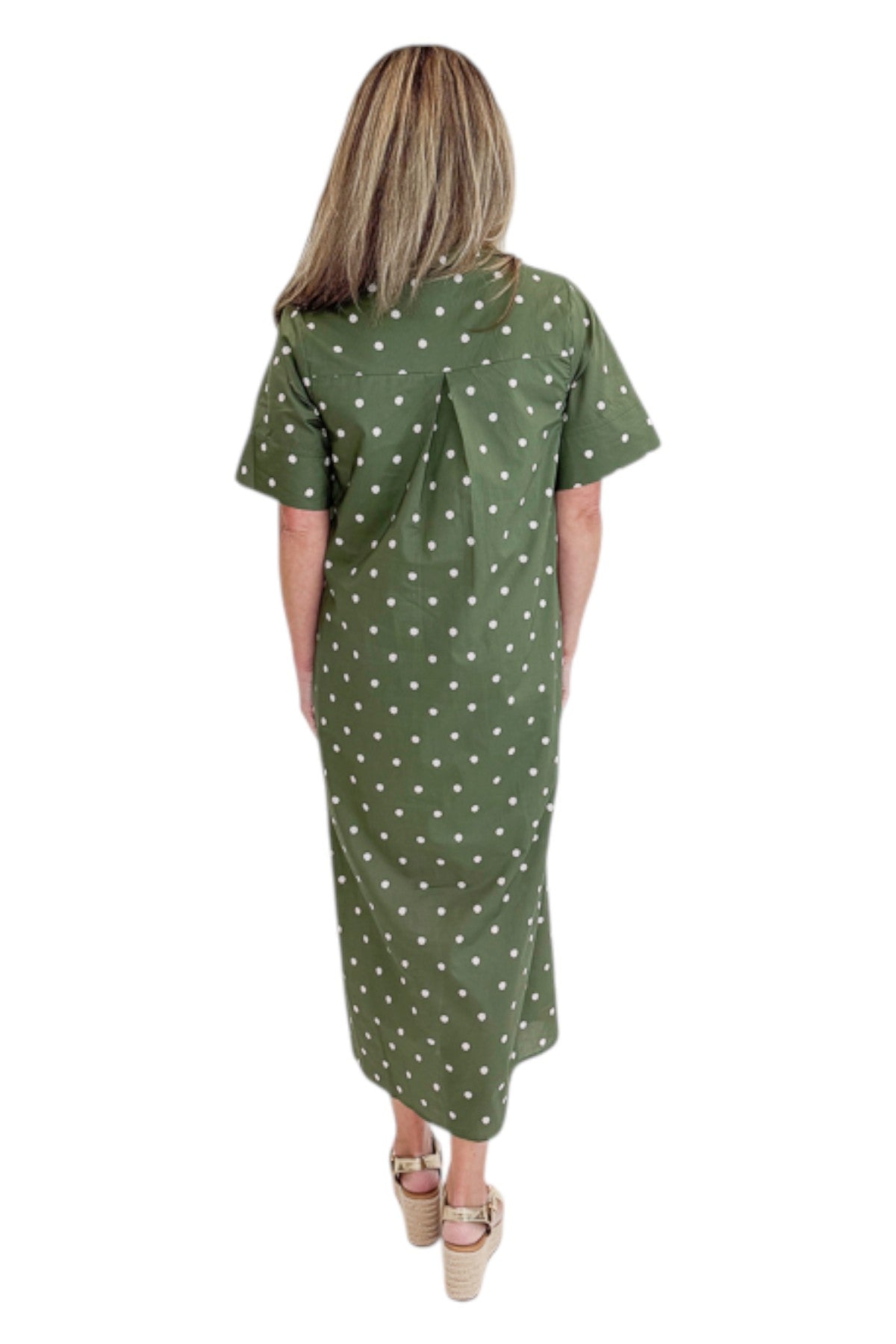 Back view of woman wearing Swagger Boutique’s Olive Polka Dot Midi Dress by Entro with sandals against white studio background.