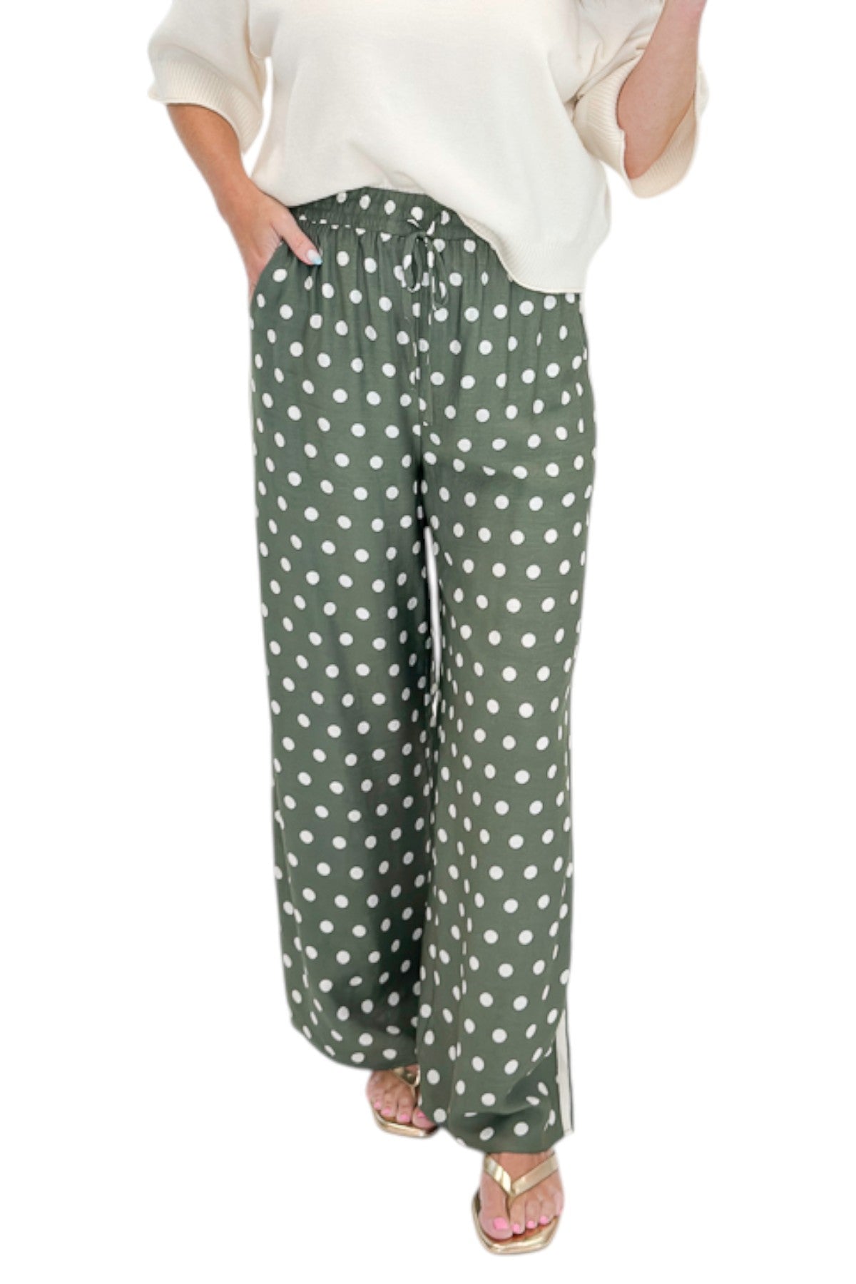 Front view of woman wearing Swagger Boutique’s Cream 3/4 Sleeve Lightweight Sweater by Entro with Olive Polka Dot Stripe Trim Pants by Entro against white studio background.