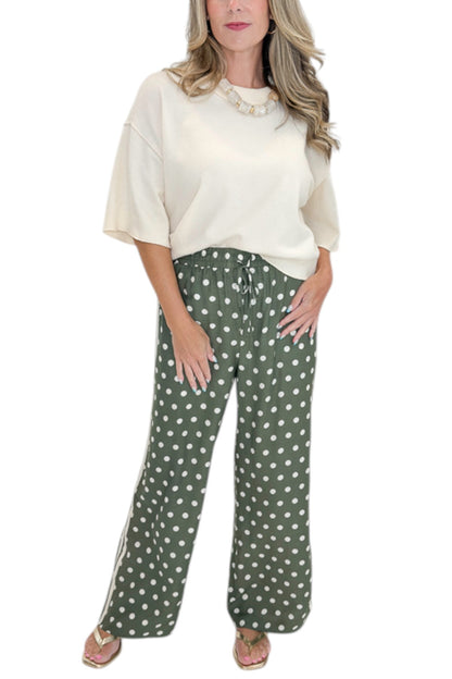 Front detail view of woman wearing Swagger Boutique’s Cream 3/4 Sleeve Lightweight Sweater by Entro with Olive Polka Dot Stripe Trim Pants by Entro against white studio background.