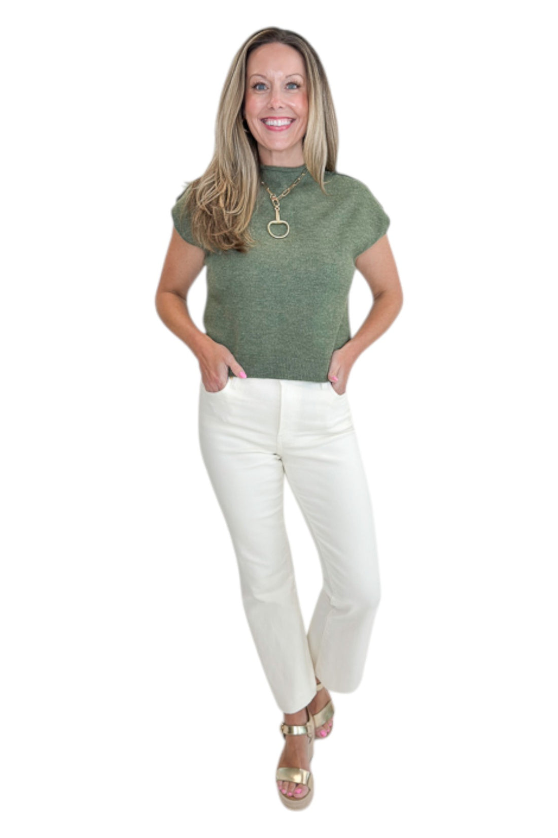 Front view of woman wearing Swagger Boutique’s Olive Sleeveless Sweater by Entro with jeans against white studio background.