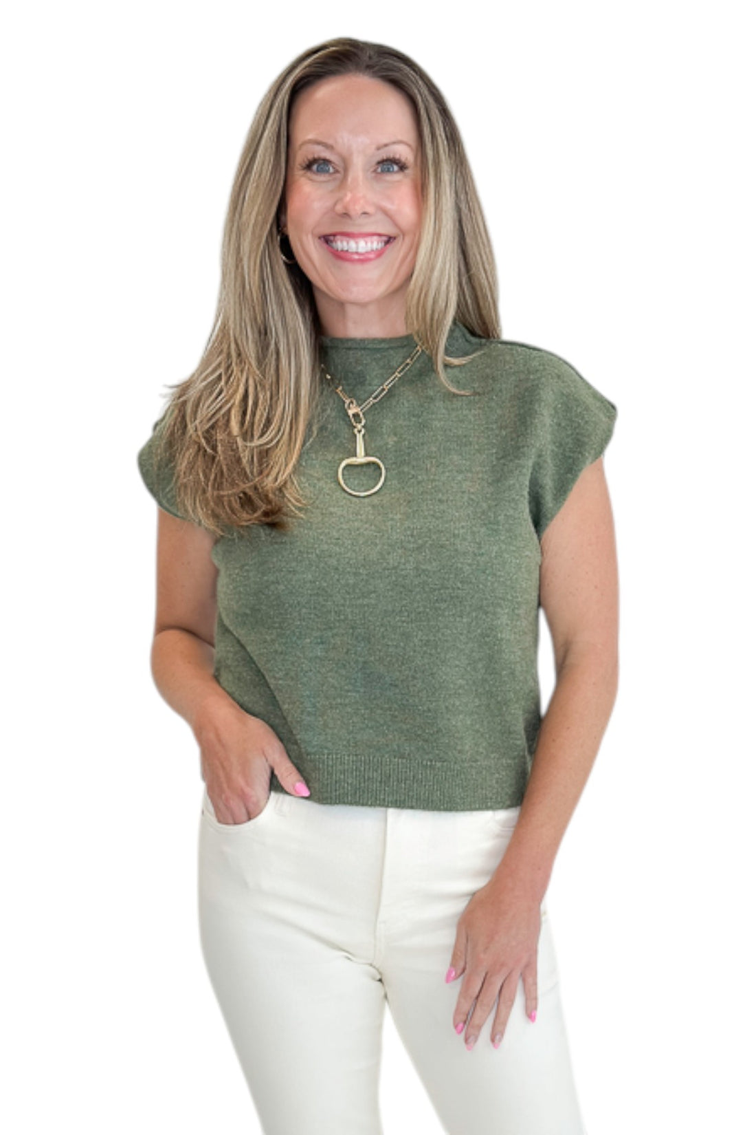 Front view of woman wearing Swagger Boutique’s Olive Sleeveless Sweater by Entro with jeans against white studio background.