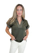 Front view of woman wearing Swagger Boutique’s Olive Stitched Short Sleeve Top by Entro with jeans against white studio background.