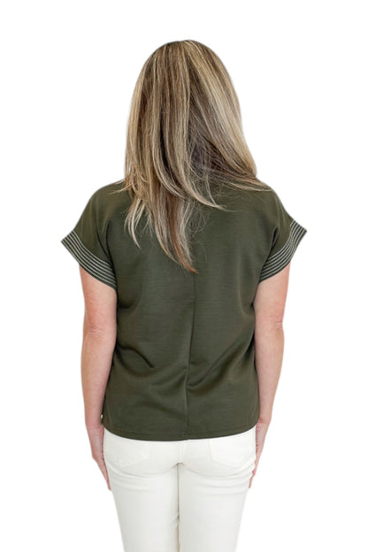 Back view of woman wearing Swagger Boutique’s Olive Stitched Short Sleeve Top by Entro with jeans against white studio background.