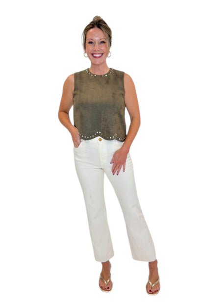 Front view of woman wearing Swagger Boutique’s Olive Suede Stud Tank with Kelsey Ecru Jeans against white studio background.