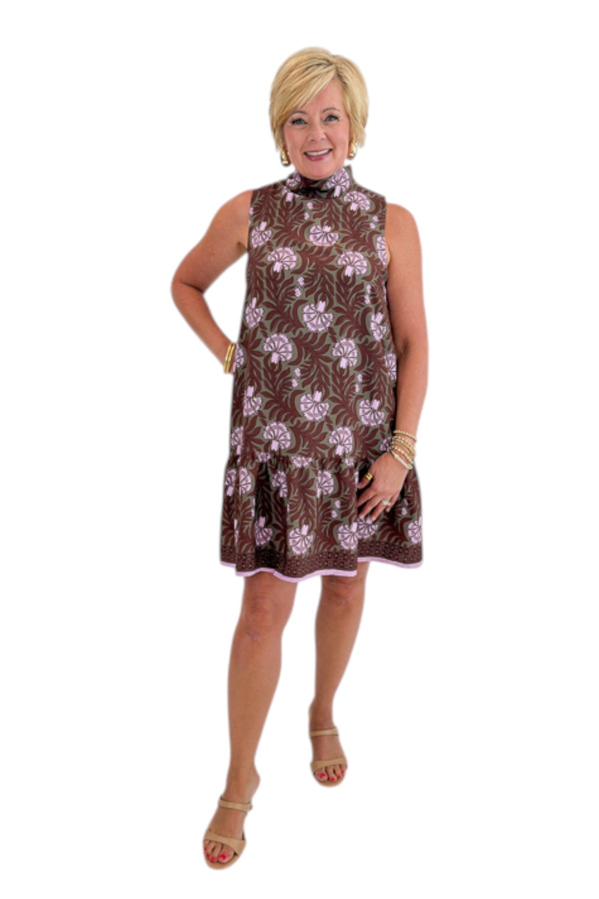 Front view of woman wearing Swagger Boutique’s Olive &amp; Brown Floral Halter Neck Mini Dress against white studio background.
