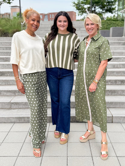 Front view of women wearing Swagger Boutique’s Olive &amp; Cream Striped clothes by Entro with jeans walking outside down a staircase.