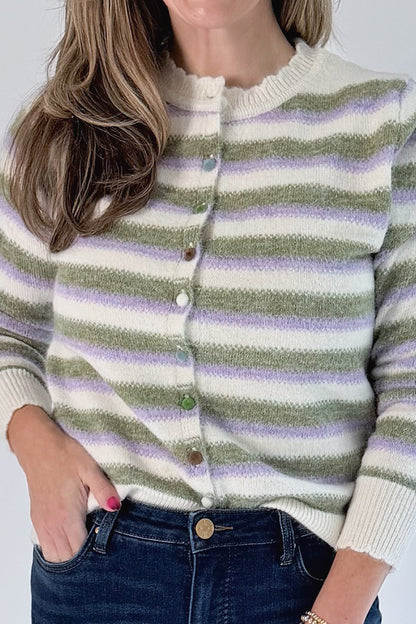 Front detail view of woman wearing Swagger Boutique’s Olive &amp; Lavendar Striped Button Up Cardigan with jeans against white studio background.
