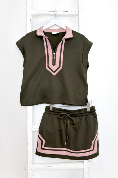 Swagger Boutique’s Olive &amp; Pink Skirt &amp; Matching Top by Entro hanging against white studio background.