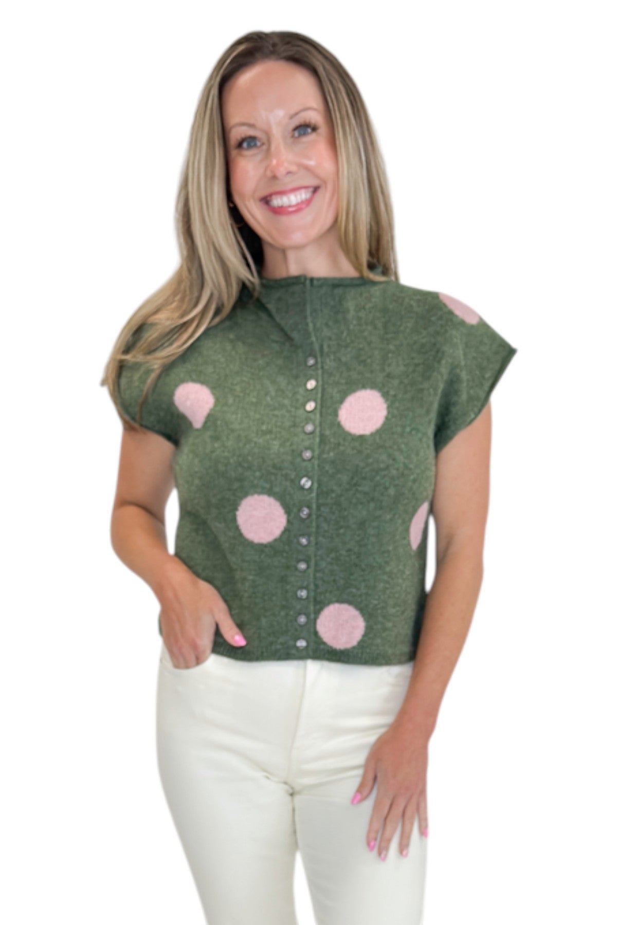 Front view of woman wearing Swagger Boutique’s Olive &amp; Pink Polka Dot Sleeveless Button Up Sweater by Entro with jeans against white studio background.