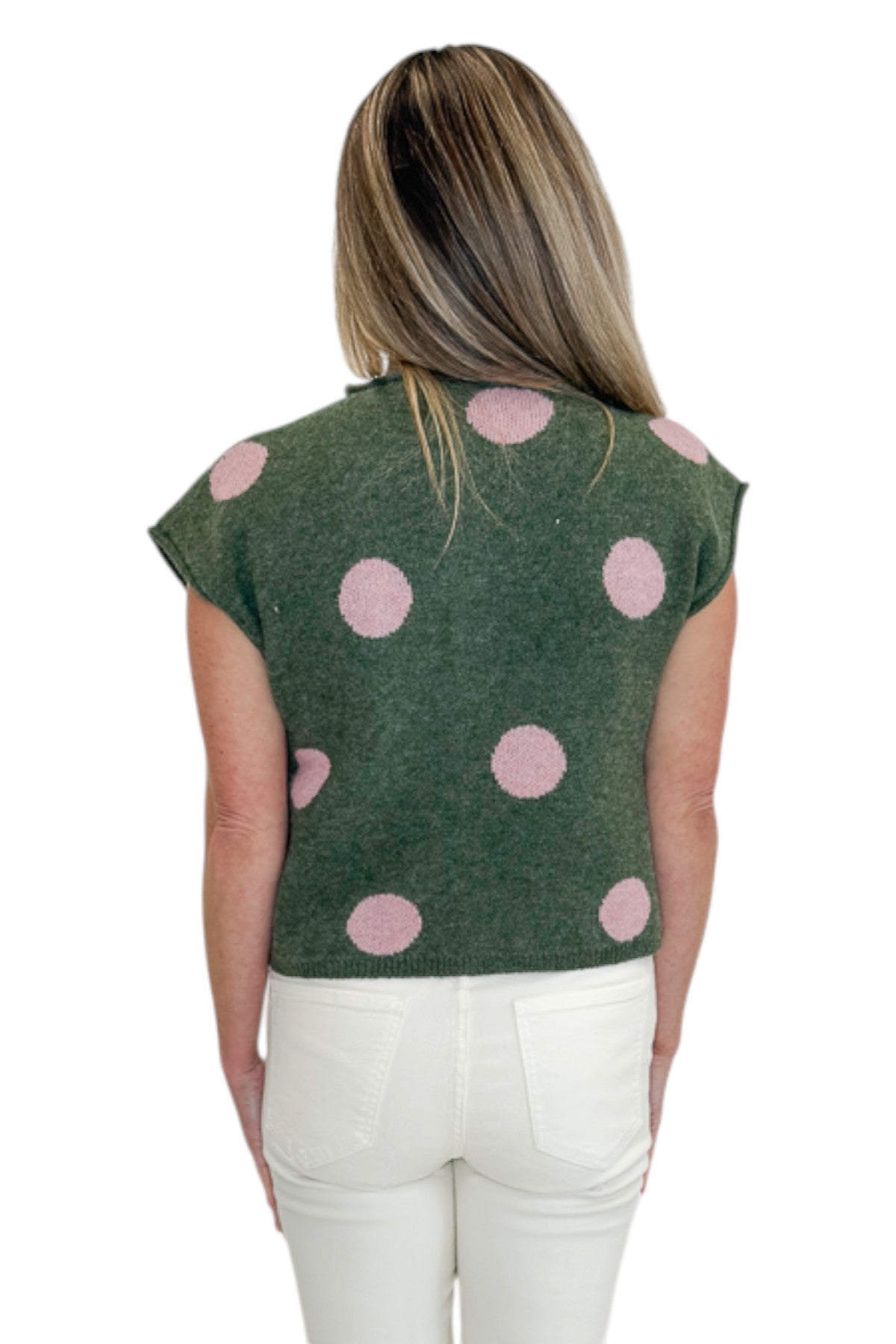 Back view of woman wearing Swagger Boutique’s Olive &amp; Pink Polka Dot Sleeveless Button Up Sweater by Entro with jeans against white studio background.