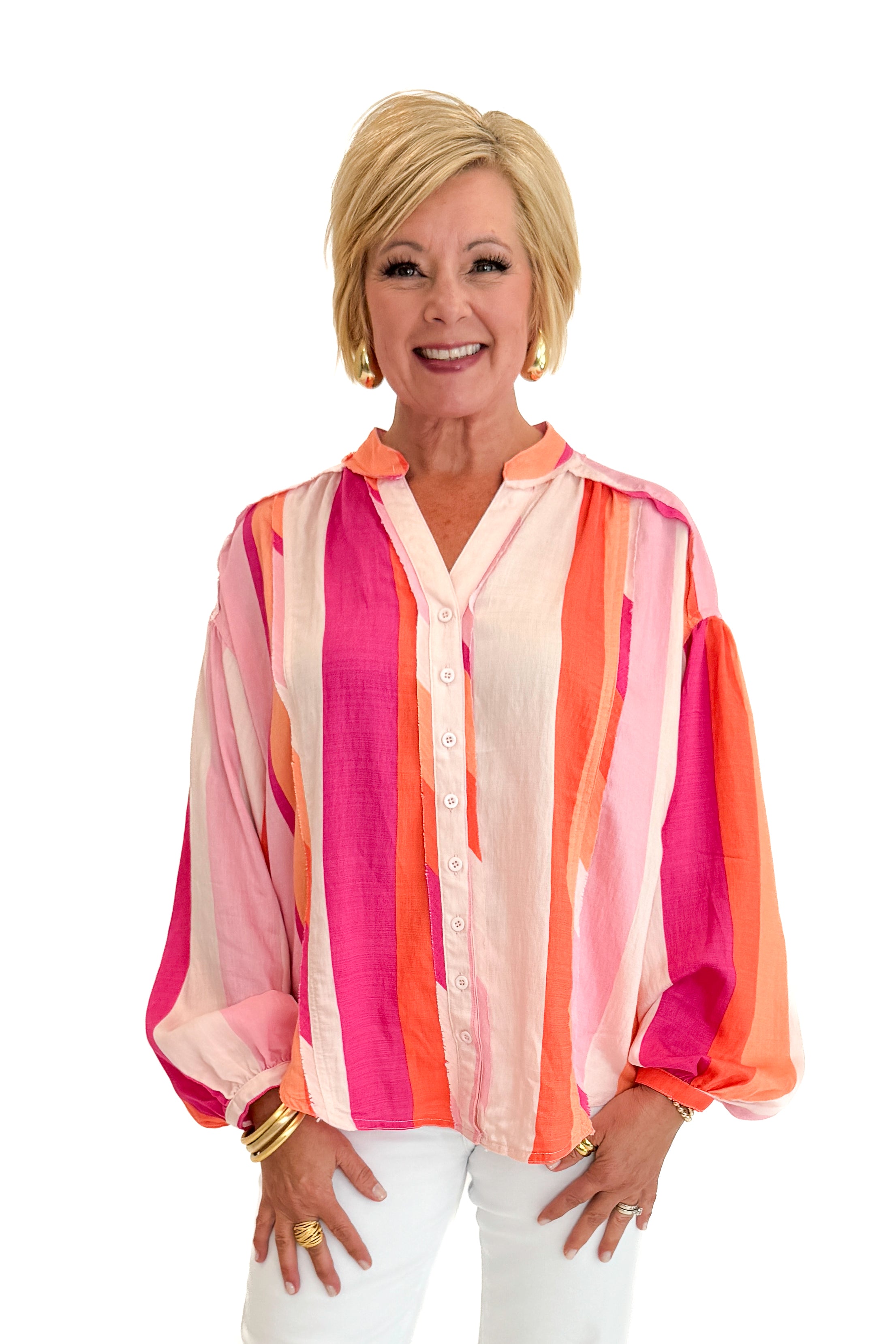 Front view of woman wearing Swagger Boutique’s Orange &amp; Pink Striped Top with jeans against white studio background.