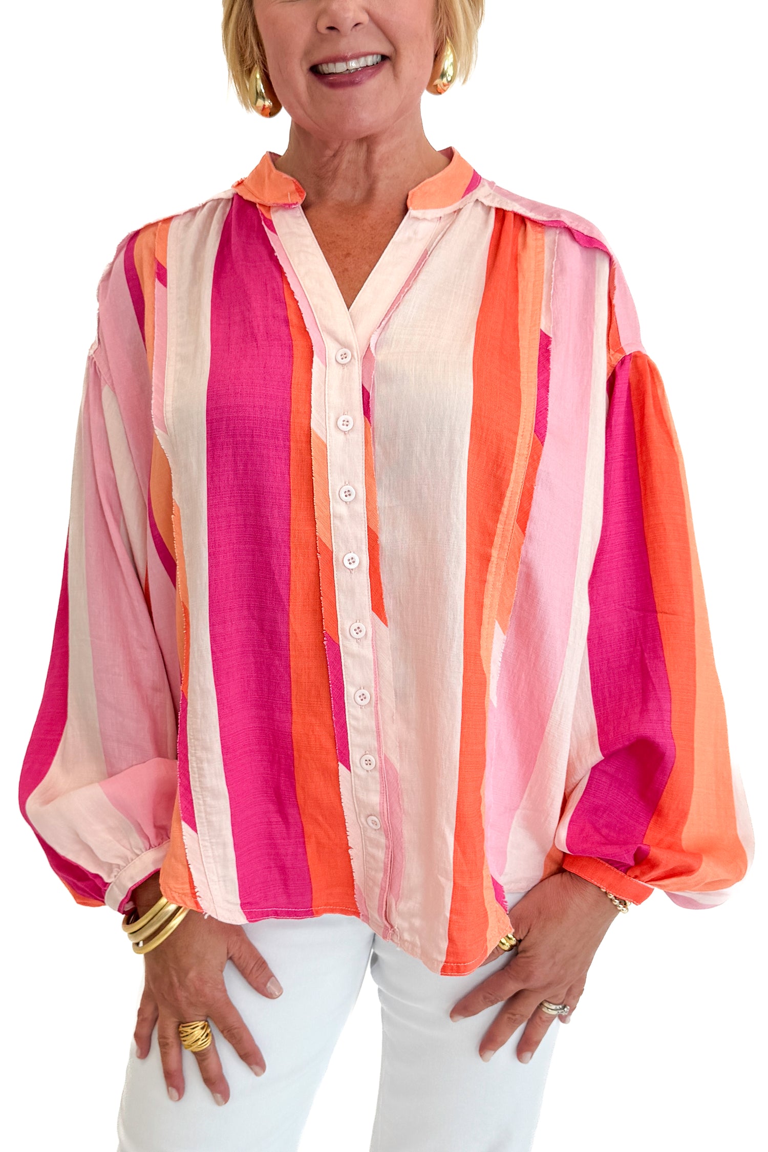Front detail view of woman wearing Swagger Boutique’s Orange &amp; Pink Striped Top with jeans against white studio background.