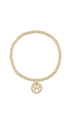 Gold beaded bracelet with a paw print charm on a white background