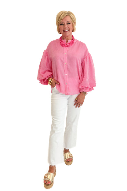 Front view of woman wearing Swagger Boutique’s Pink Pinstripe Bubble Sleeve Top with jeans against white studio background.