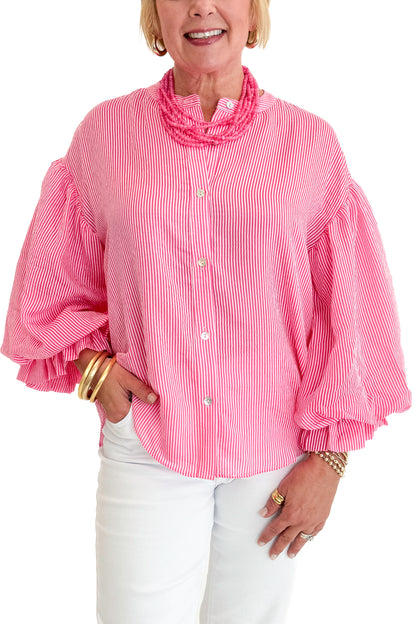 Front detail view of woman wearing Swagger Boutique’s Pink Pinstripe Bubble Sleeve Top with jeans against white studio background.