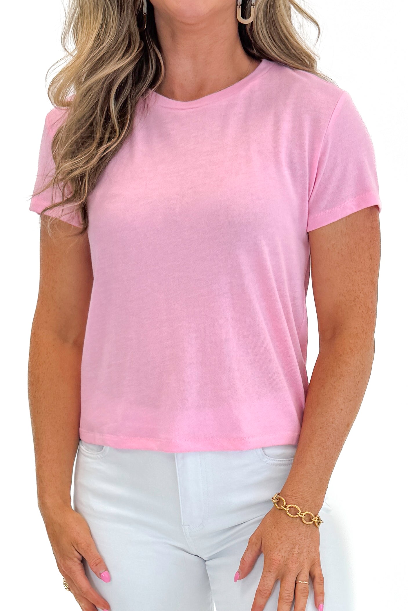 Front detail view of woman wearing Swagger Boutique’s Pink Sunrise Tourist Tee by Z Supply with jeans against white studio background.