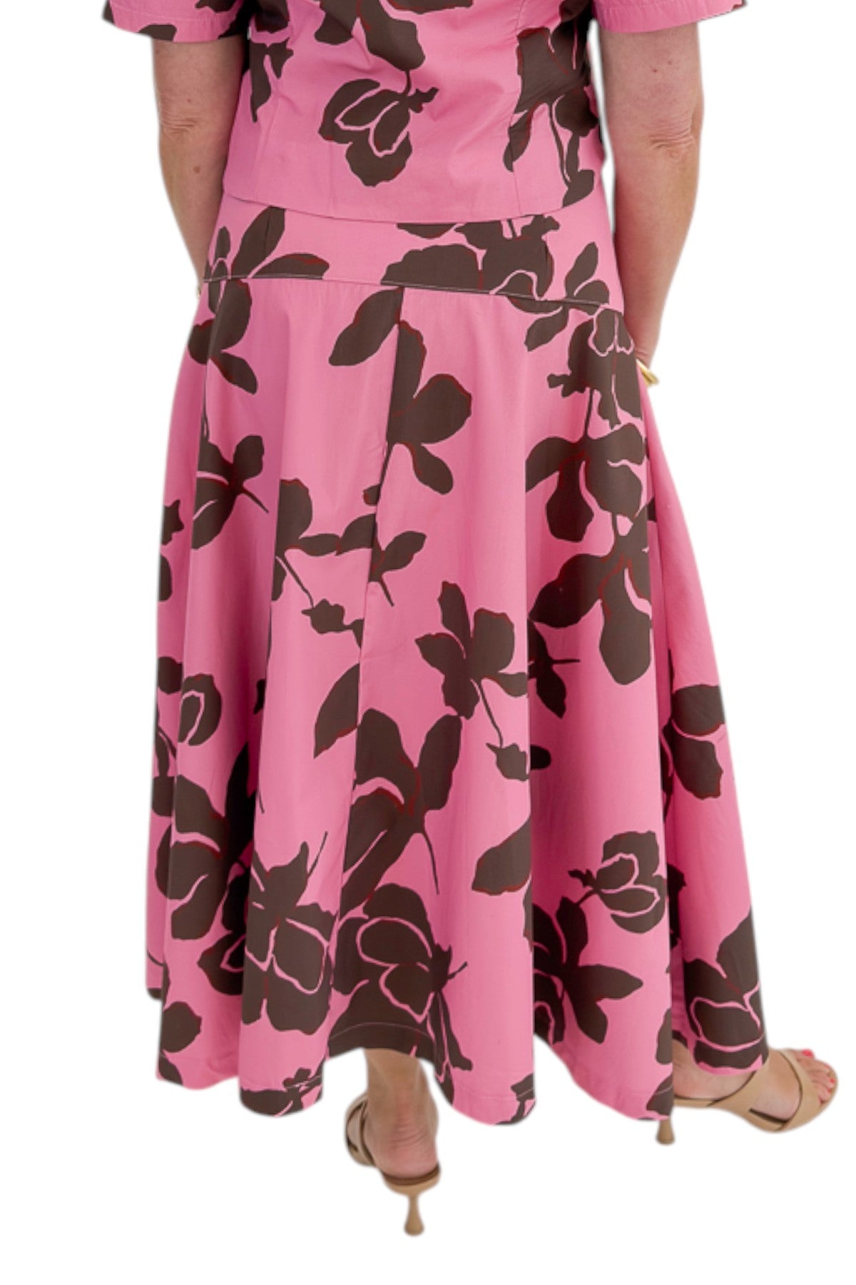 Back view of woman wearing Swagger Boutique’s Pink &amp; Brown Floral Midi Skirt &amp; Pink &amp; Brown Floral Button Up Top by Entro against white studio background.