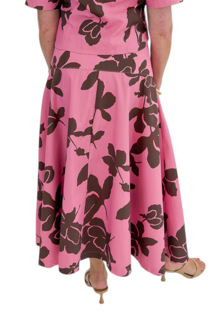 Back view of woman wearing Swagger Boutique’s Pink &amp; Brown Floral Midi Skirt &amp; Pink &amp; Brown Floral Button Up Top by Entro against white studio background.